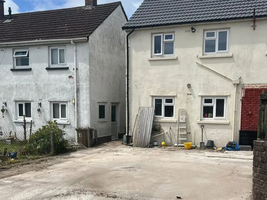 The same yard cleared to a bare concrete slab