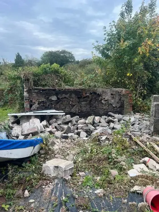 Crew clearing rubble on site in South Wales