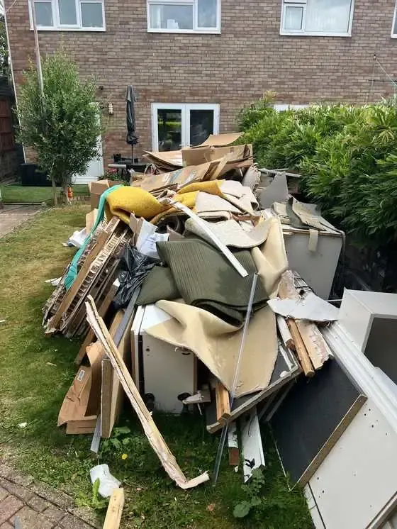 Garden rubbish clearance including old carpet and boxes