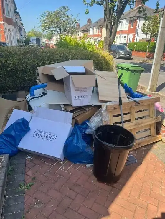Cardboard and old appliances cleared from a house